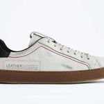 Men's ORIGINAL LC06 Low-top in Retro White Leather, displays the red stitiching and patchwork logo, shown from the side profile.