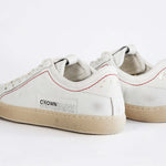 Women's ORIGINAL LC06 Low-top in Retro White Leather offers a retro inspired design as shown from the back view.