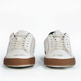 Men's ORIGINAL LC06 Low-top in Retro White Leather, displays the red stitiching and patchwork logo, emphasising craftsmanship.