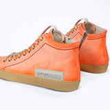 Men's ORIGINAL LC17 High-top Handpainted Orange Canvas offers a casual street-style, shown from the back.