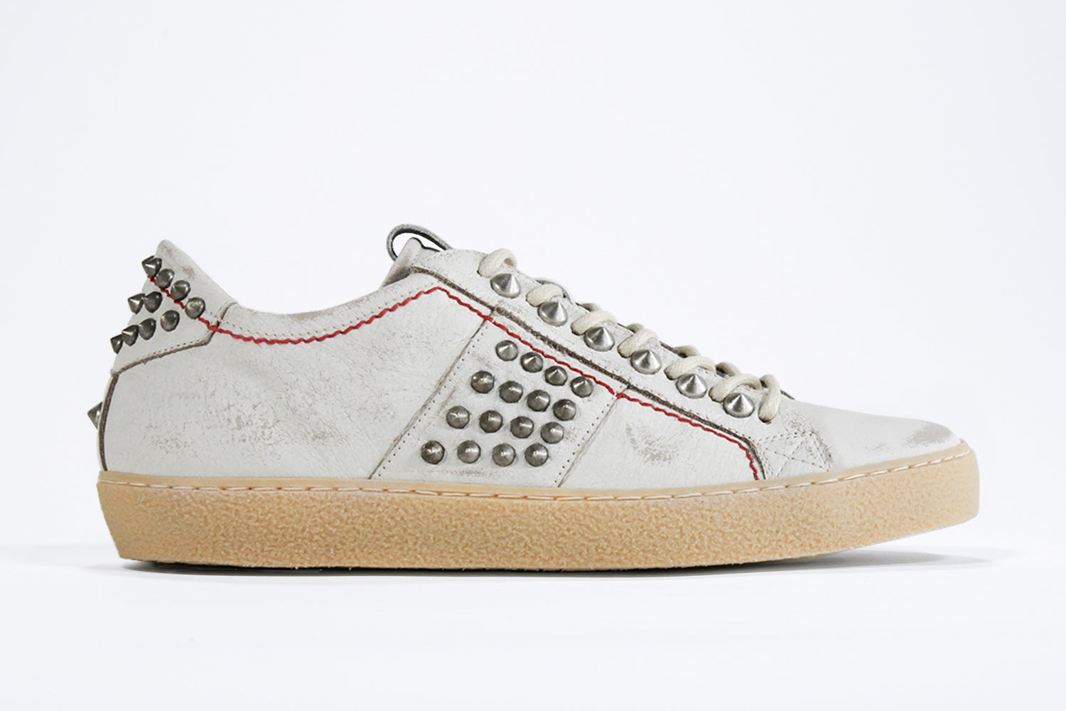 Women's ORIGINAL STUDLIGHT Low-top White Leather & Studs shown from the side showcasing an edgy style.