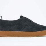  Men's SLIP ON Moccasin Sneaker in Navy Suede shown from the side, showcasing a sleek versatile design.