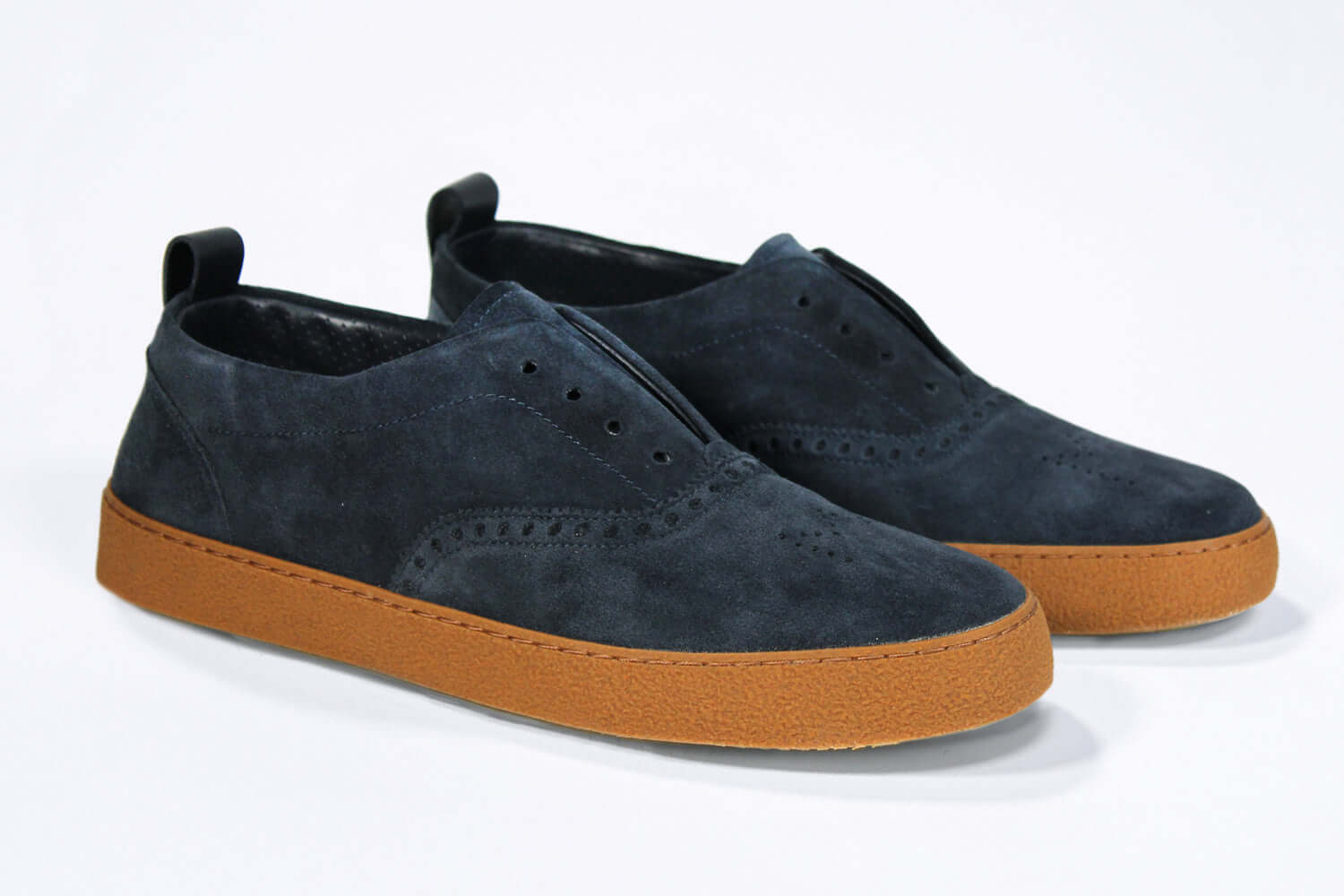 Men's SLIP ON Moccasin Sneaker in Navy Suede with a honey coloured rubber sole and subtle Crown logo.