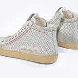 Women's ORIGINAL LC17 High-top Perforated Aged-White Leather sneaker with signature red stitching and a dark natural rubber sole.