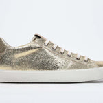 Women's Low-top PURE sneaker in Metallic Gold Leather with a sleek side profile perfect to add shine to any outfit.