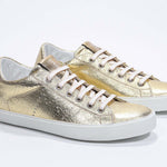 Women's Low-top PURE sneaker in Metallic Gold Leather showing white cotton laces and a low top line.
