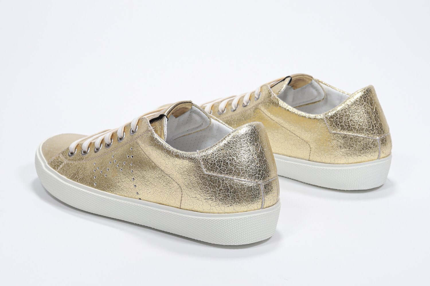 Women's Low-top PURE sneaker in Metallic Gold Leather shown from the back, displaying the Italian craftsmanship.