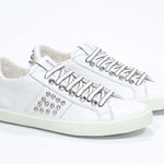  Women's Low-top STUDLIGHT in White Leather and Silver Studs sneakers offers an edgy and clean silhouette.